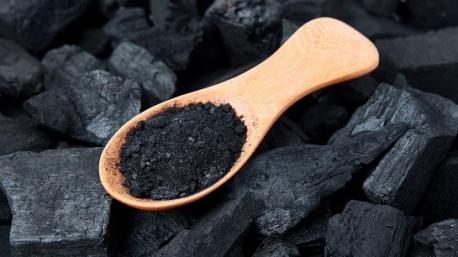 If the idea of using charcoal as a cure-all beauty remedy sounds vaguely familiar, that's because it's been added into topical face masks, cleansers, and creams as a method of drawing dirt out of the pores and purifying the complexion for decades. Now, the food and wellness industry is attempting to apply its benefits to your digestive tract. It's a line of reasoning that may have roots in the medical community, where activated charcoal has been largely used as a remedy for the ingestion of poisons. 