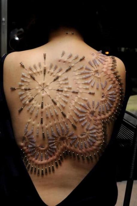 Scarification -- Scarifying involves scratching, etching, or burning into the skin as permanent body modification. It is an ancient practice that seems to be re-surfacing nowadays. Would you try this?