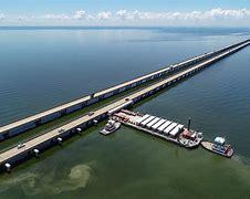 Located in Louisiana, Lake Pontchartrain Causeway is one of the biggest bridges in the US. It is the longest continuous bridge that spans over water, measuring 23.87 miles. It doesn't have any artificial island in between like that of the Hong Kong-Macau Bridge. The bridge connects Mandeville and New Orleans on the opposite side. Commuters do not have to drive around the lake, which reduces the drive time by one hour at a speed of 65mph. Have you ever driven on this bridge?