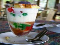 Halo-halo is a Filipino dessert that is a mixture of shaved ice and evaporated milk to which are added various boiled sweet beans and fruits, and served in a tall glass or bowl. Have you eaten a Halo-halo dessert?