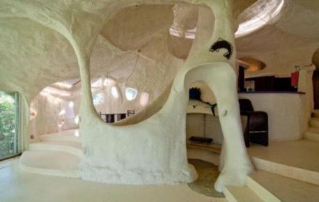 Minnesota: Ensculptic House - Made out of hardened polyurethane insulation foam, the Ensculptic House was built by architect Winslow Wedin in 1969. If you view it from the top or the side, the Minnesotan home looks like a giant mushroom, with small pockets of light illuminating the creative spaces inside. The residence is still privately owned. Would you like to live in a house that resembles a mushroom?