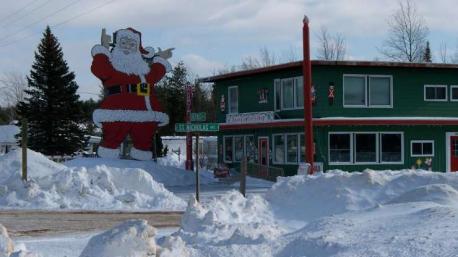 Christmas, Michigan - You'll be greeted by a giant Santa Claus when you enter this small town on Michigan's Upper Peninsula, and well, that's exactly what you'd expect to see in a place called Christmas. All the shops and stores have a holiday theme here, but just driving through offers a thrill, especially for the younger set. Have you ever visited this town?