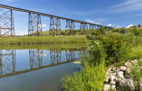 North Dakota: Hi-Line Bridge - This historic railroad bridge could have been pulled straight from an old Western movie. It was completed more than a hundred years ago, in 1908, and beats an unswerving path across the Sheyenne River in Valley City. Held up to its 162-foot (49m) height by 30 hardy towers, the bridge was pivotal in the Second World War as supplies and soldiers were transported over the river in coast-to-coast journeys. It was closely guarded during the entire conflict. Have you ever visited this bridge?