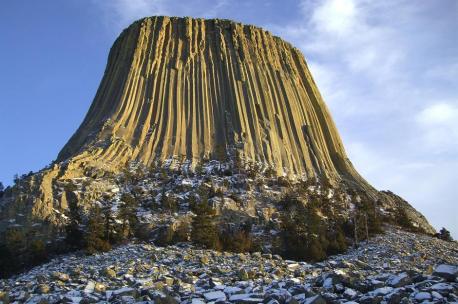 Wyoming: Devils Tower - The volcano-like landform which acts as the alien's touchdown spot and point of obsession for Richard Dreyfuss' character in Close Encounters of the Third Kind is Devils Tower in the Bear Lodge Mountains of northeastern Wyoming. It has long been a sacred site for indigenous communities and was designated as America's first National Monument in 1906, but it saw a surge in interest from visitors after the film came out in 1977. Have you watched this movie?