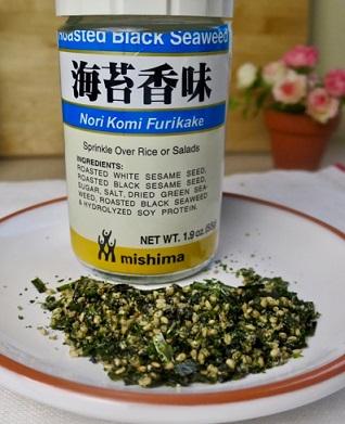 Furikake is a Japanese savory dry seasoning, used as a condiment, often sprinkled on rice, vegetables, fish and as a filling for onigiri (rice balls). Have you ever tried any?